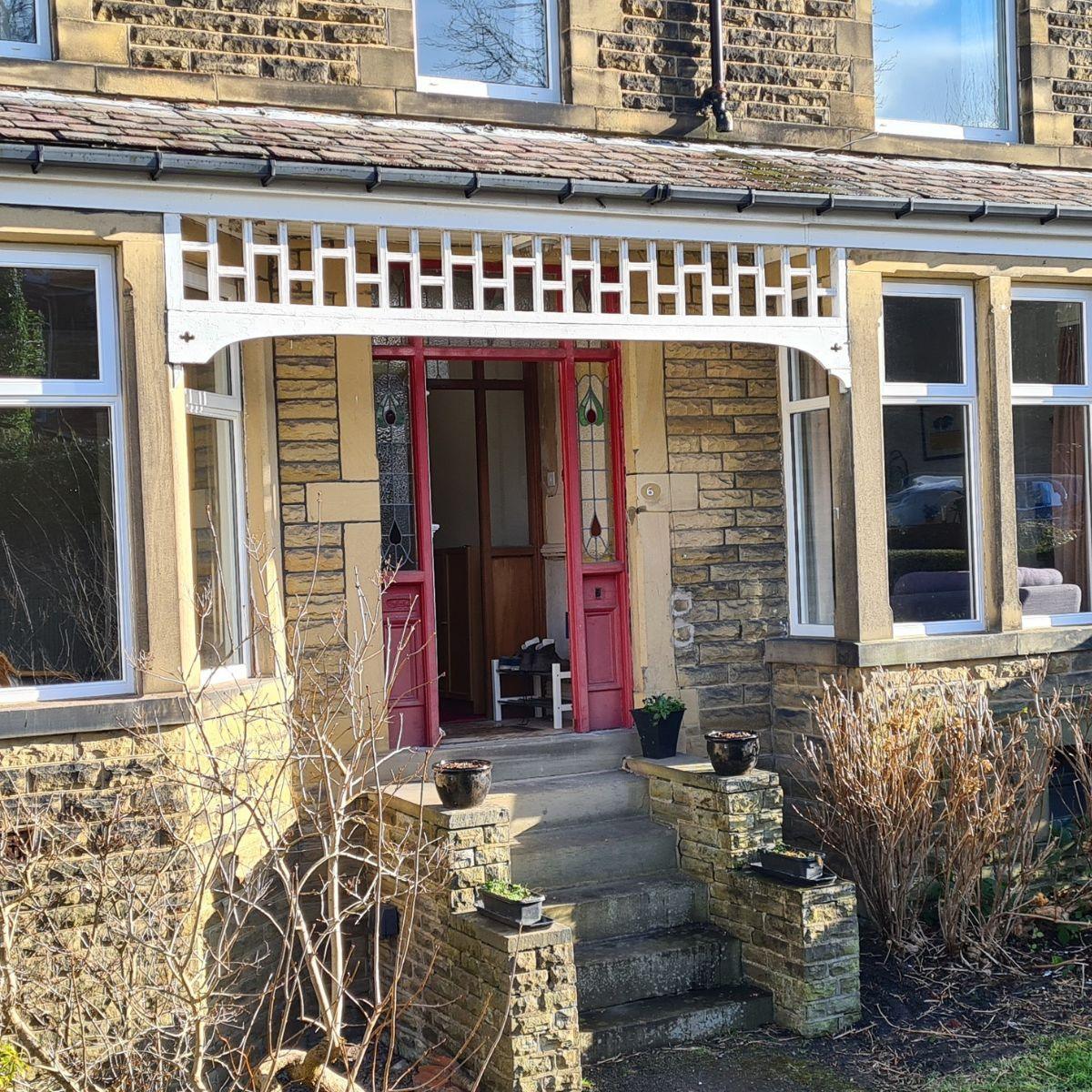 Period house with heritage-style windows and stained glass