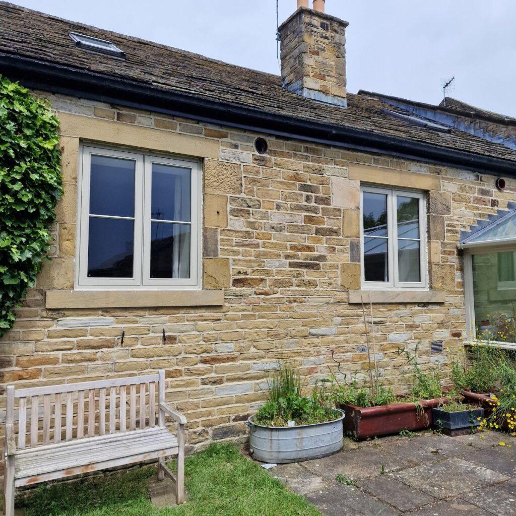 Stone cottage with Farrar casement windows
