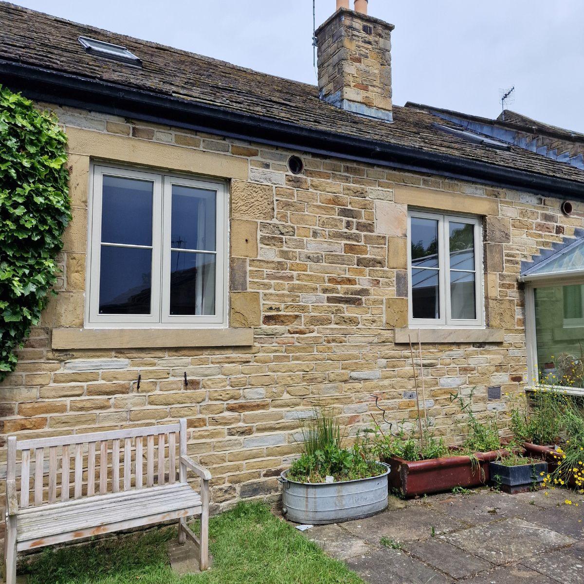 Stone cottage with Farrar casement windows