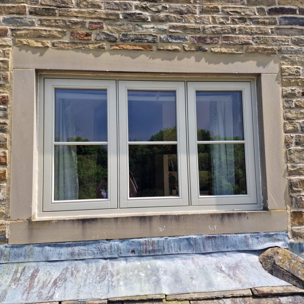 Close-up of Farrar flush casement window in Yorkshire stone