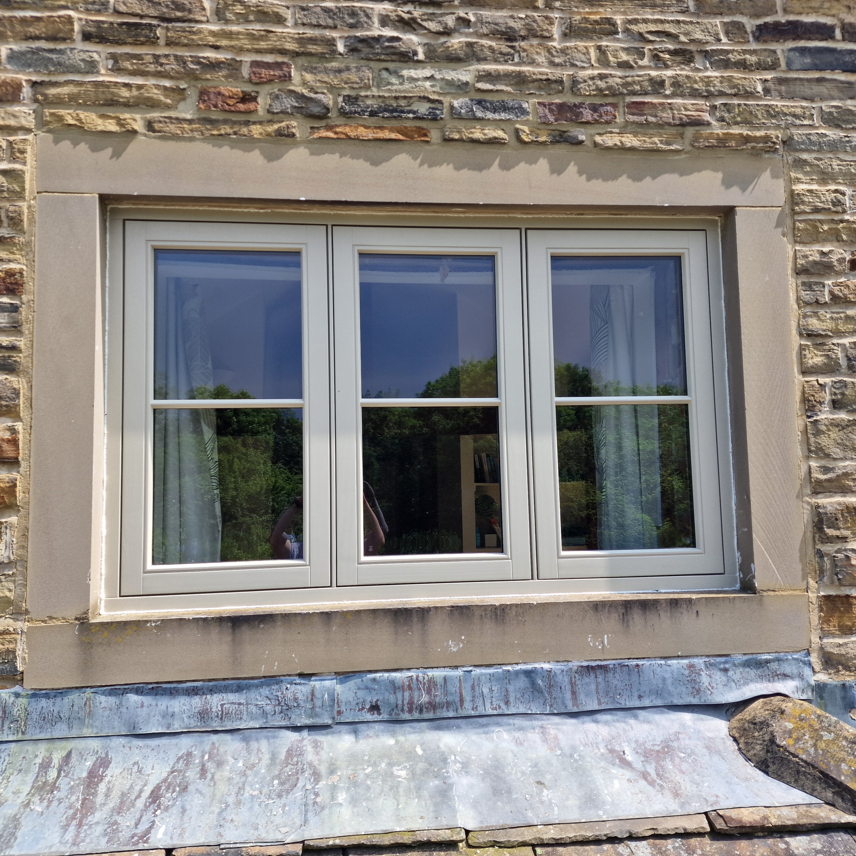 Close-up of Farrar flush casement window in Yorkshire stone