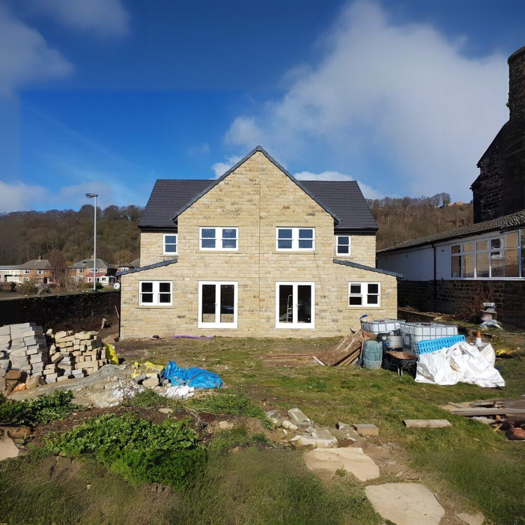 White timber casement windows in a Yorkshire stone elevation