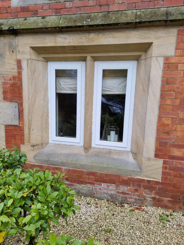 Timber stormproof casement window in a stone surround