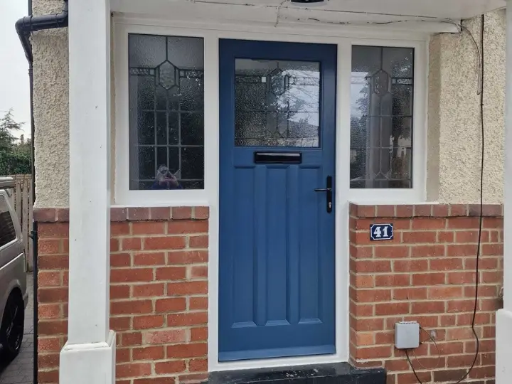 Blue painted timber front door with leaded glass sidelights on a brick residential property – Farrar Joinery