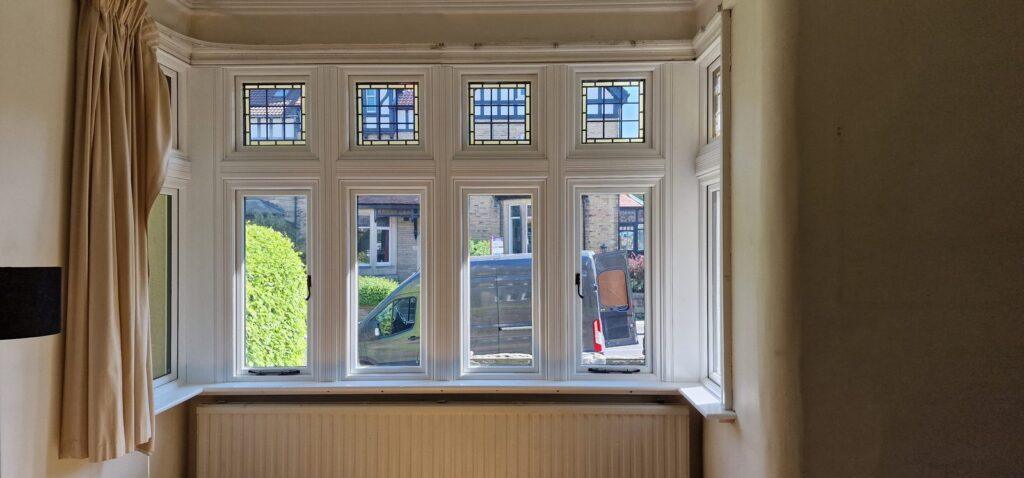 Interior bay window with leaded toplights and period mouldings at Burley in Wharfedale