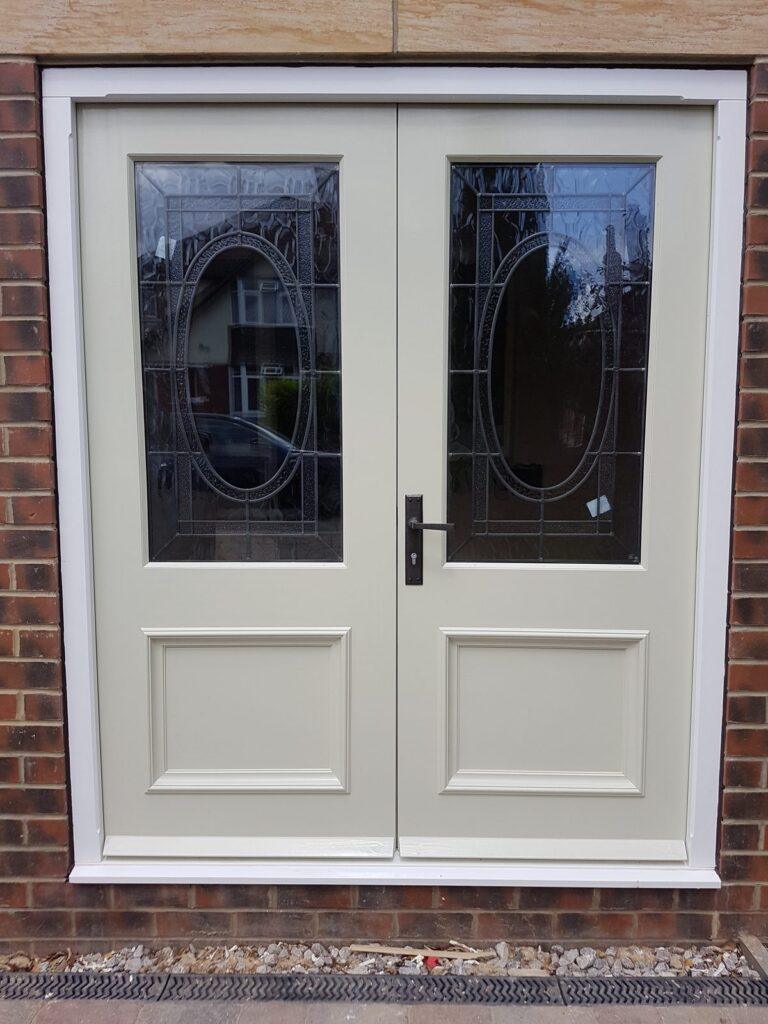 French doors with original stained glass encapsulated in the glazing