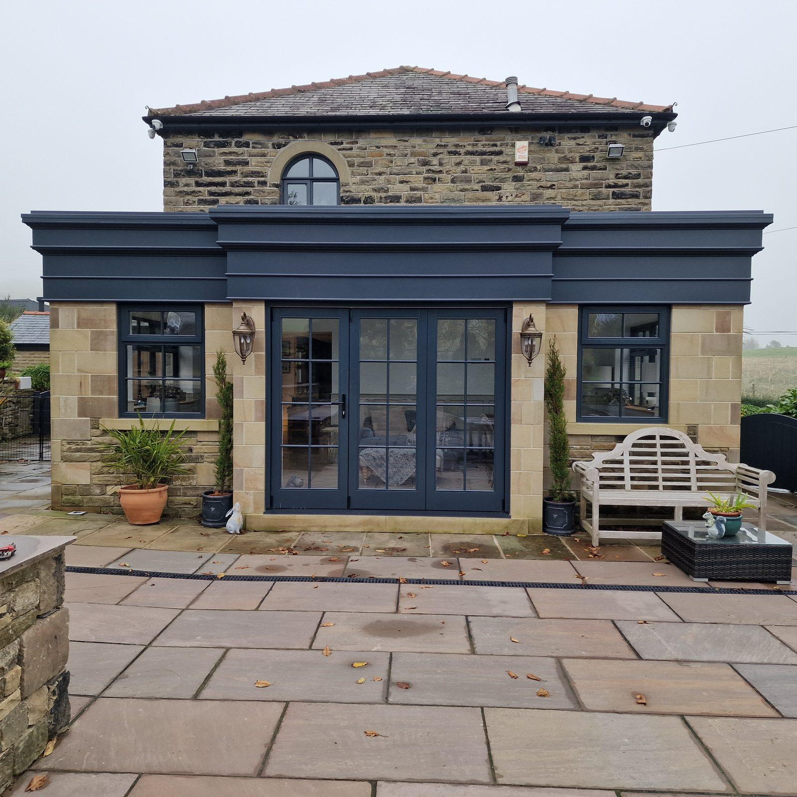 Orangery at Shibden Valley with dark timber French doors and glazing